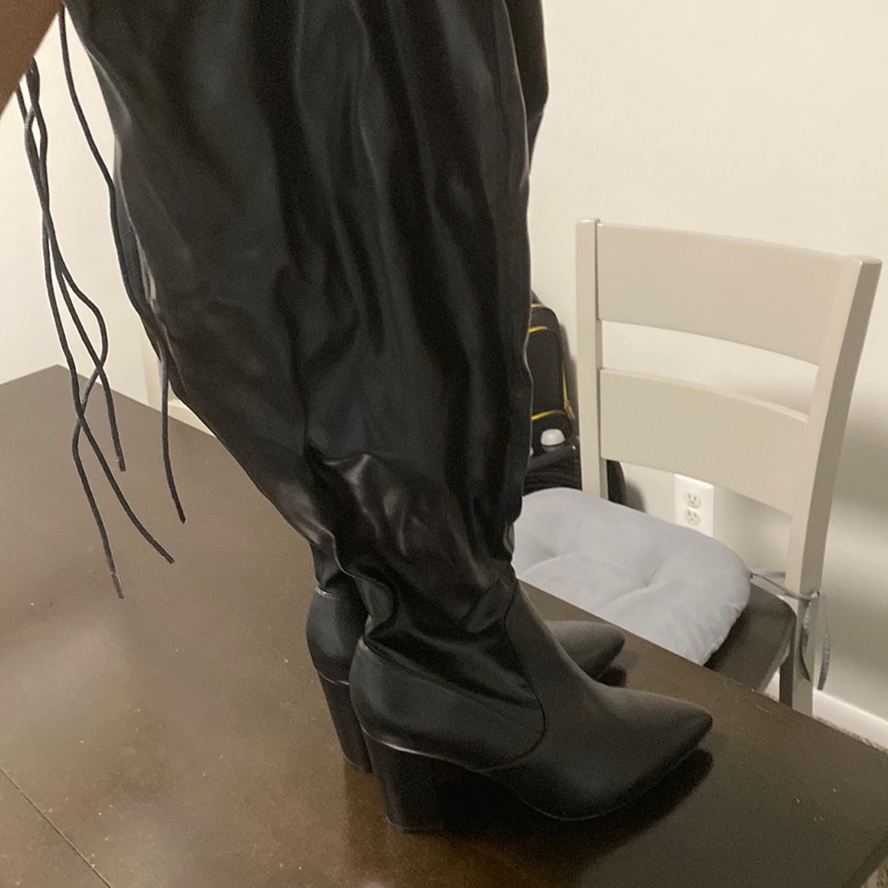 Block heel thigh high boots with elastic wide calf.